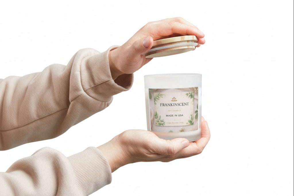 Person holding a Frankincense candle with a plain background